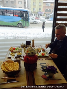 Breakfast at Dayi restuarant, snow coming down and locals waiting for bus. Erzurum Turkey 4Feb2015
