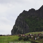 Going up there soon. Horse riding in the foreground_Seongsan llchulbon Jeju Korea 15 Sept 2015 